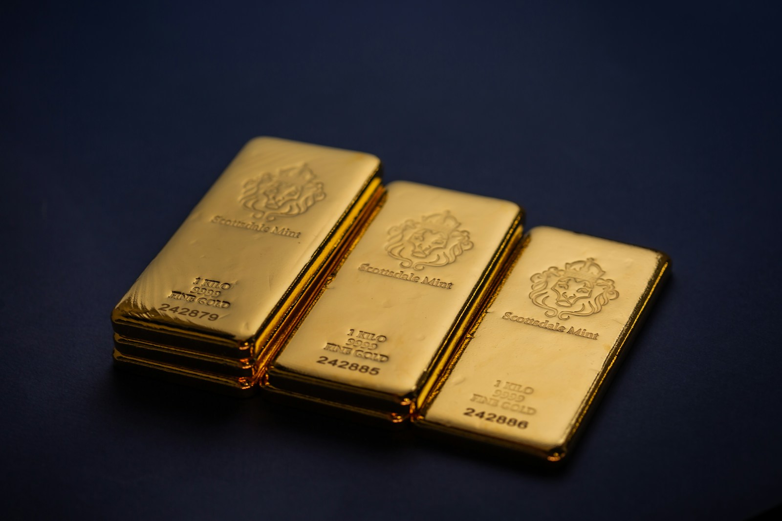 Three gold bars stacked on top of each other