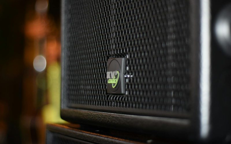 Black Speaker On Brown Wooden Stand