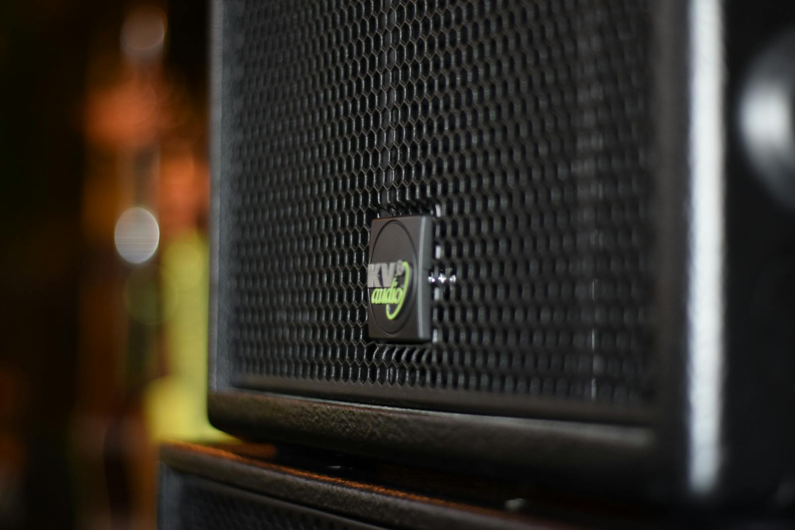 Black Speaker On Brown Wooden Stand