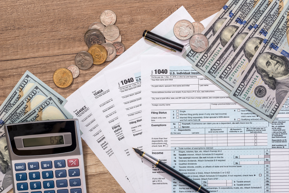 Closeup,Of,Us,Tax,Form,And,Us,Money,With,Calculator,